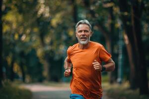 Senior man running in the park photo