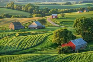 Farm in rural area with red barn and green fields photo