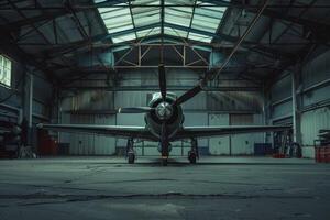 A plane is sitting in a hangar with a roof photo
