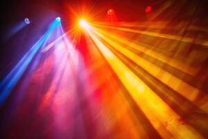 Colorful lights on a stage with bright beams photo