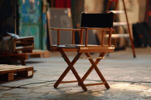 A director's chair sits in front of a wooden table photo