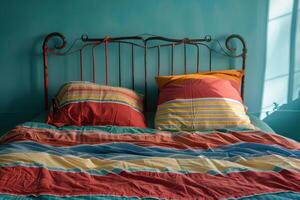 A bed with colorful pillows and a red headboard photo