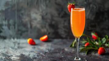 A glass of champagne with strawberries on the side photo