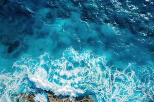 An aerial view of the ocean and waves photo