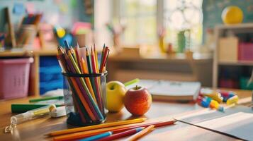 School supplies on a desk in a classroom photo