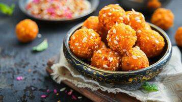 A bowl filled with orange balls on a table photo