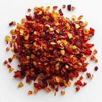 Pile of dried chili flakes placed in the center of a white background creating a bold spicy statement photo