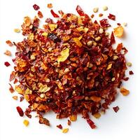Pile of dried chili flakes placed in the center of a white background creating a bold spicy statement photo
