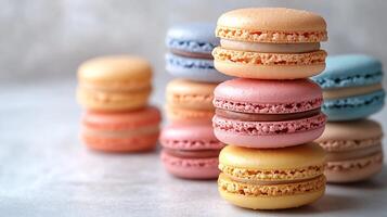 Stack of colorful macarons placed on a pristine white background creating a vibrant and delicate display photo