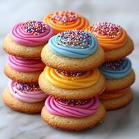 Stack of sugar cookies with colorful icing placed on a clean white background bright and festive photo