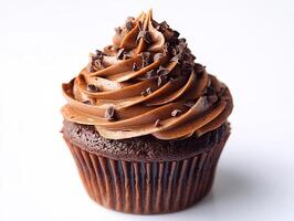 Swirl of chocolate frosting on a cupcake placed on a clean white background rich and decadent photo