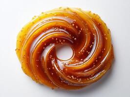 Swirl of sweet and tangy teriyaki sauce on a white background creating an abstract glossy texture photo