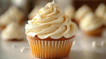 Swirl of vanilla buttercream frosting on a cupcake placed on a white background creamy and smooth photo