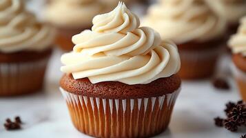 Swirl of vanilla buttercream frosting on a cupcake placed on a white background creamy and smooth photo