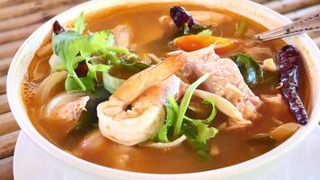 A bowl of soup with shrimp and vegetables video