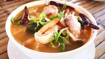 A bowl of soup with shrimp and vegetables video