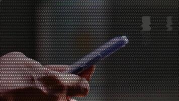 A person holding a cell phone with a binary code on it video