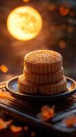 Stack of mooncakes with glowing full moon in background photo