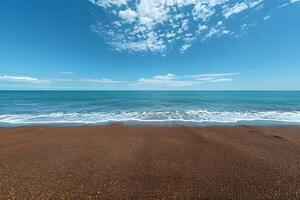 Tranquil Beachscape with Clear Blue Sky and Calm Ocean Waves - Nature Background for Relaxation and Serenity photo