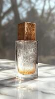 Transparent perfume bottle casting a shadow on a tabletop photo