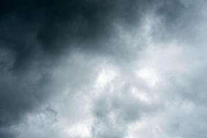 Dark dramatic storm cumulus clouds in autumn. An impending storm, hurricane or thunderstorm. Bad weather. photo