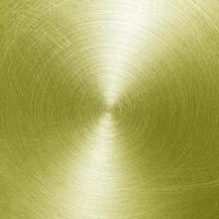 Golden circular brushed shiny metal texture. Abstract metallic background. Circle shape. photo