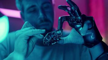 A Prosthetic Hand Holds a Fragile Part video