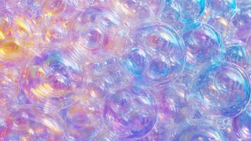 A colorful image of many small bubbles in various colors. The bubbles are floating in the air and appear to be floating in a rainbow. photo