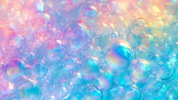 A colorful image of many small bubbles in various colors. The bubbles are floating in the air and appear to be floating in a rainbow. photo