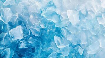 A blue background with ice cubes scattered throughout. The ice cubes are in various sizes and shapes. photo