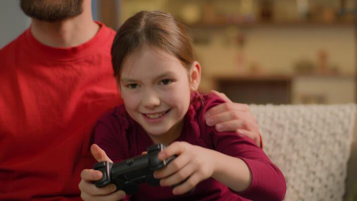 Caucasian family playing game addict child kid little girl play 