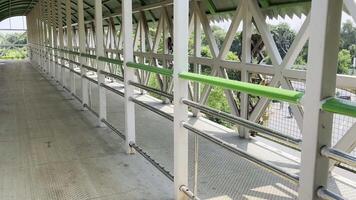 a walkway with green railings and metal railings in Lahore on September 07, 2024. video