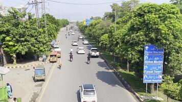 a busy street with many cars and motorcycles on it in Lahore on September 07, 2024. video