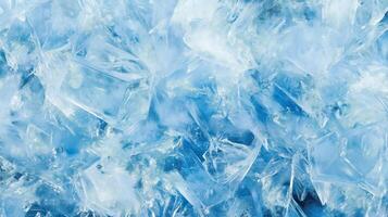 A blue background with ice cubes scattered throughout. The ice cubes are in various sizes and shapes. photo