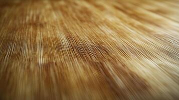 A wooden surface with a grainy texture. The wood is brown and has a natural look. The surface is smooth and has a warm, inviting feel photo