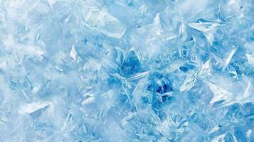 A blue background with ice cubes scattered throughout. The ice cubes are in various sizes and shapes. photo