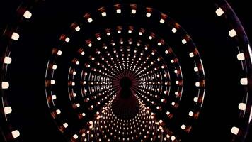 A circular tunnel with lights and a black background video