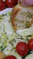 dip crouton into melted cheese recipe step by step Cooking camembert with croutons in oven. Add oil. Baked camembert with garlic sauce and spices. Cheese stretches, drips. Homemade brie in the oven. video