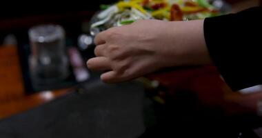 Fried white pomfret is a must-have New Year dish In Vietnam, delicious fish is cooked in a frying pan in a restaurant, immediately cooked in front of customers, boiling and bubbling in water video