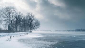 A snowy landscape with a lake and trees in the background photo