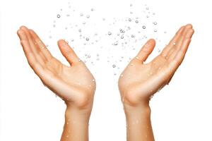A pair of sweaty hands with water droplets splashing around them. photo