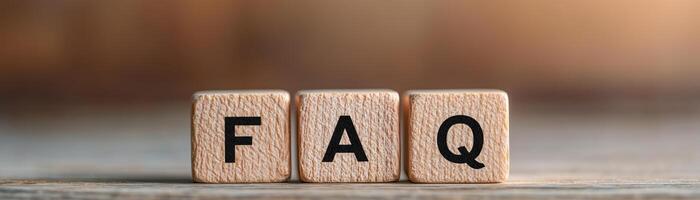 Close-up of wooden blocks displaying the letters FAQ, representing frequently asked questions. Perfect for customer service or information-related imagery. photo