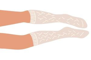 Flat illustration of legs lying on the floor. The right one is bent slightly. The white warm knitted golfs with pattern are on the feets. vector