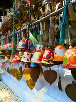 Close up shot of colourful buddhist bells photo