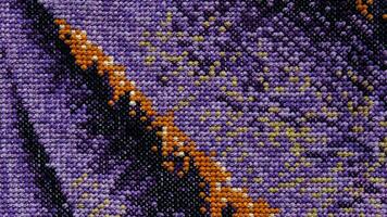 Purple, violet and brown close-up cross stitch background. Abstract Embroidered handmade Pattern. Needlework and DIY concept. Top view, macro, flat lay, mockup. photo