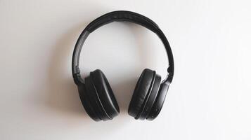 Top view of sleek black wireless headphones on a white background. photo