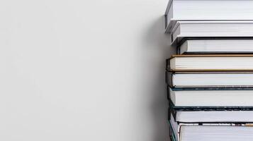 Stack of books against a white background is ideal for a range of educational themes photo