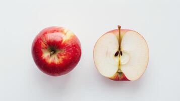 Whole and halved red apples on white background, revealing the interior photo