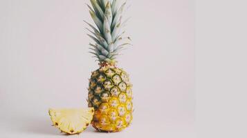 Freshly sliced pineapple on a clean white background, ready for a healthy snack or summer diet photo