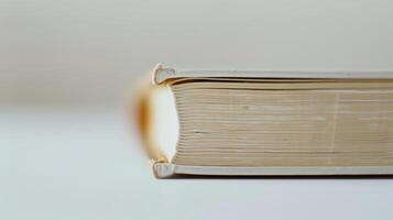 Close-up of a vintage book with gilded pages symbolizing wisdom gained through education photo